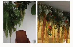 Vista detallada de plantas artificiales colgantes, arreglo floral para decoración de interiores.