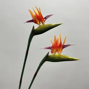 Artificial bird of paradise flower detail, realistic fake plant for home decor and wedding floral arrangements.