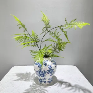 Artificial asparagus fern long branch with ceramic blue and white vase for home decor