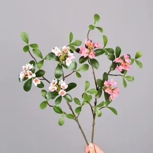Artificial plant branch with pink flowers and green leaves for home decor, ins style decoration.