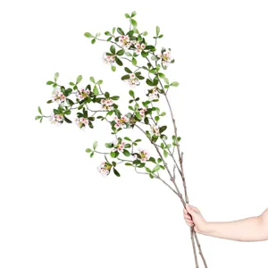 Artificial plant branch with pink flowers and green leaves for home decor and styling.