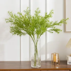Artificial green plant floral arrangement for home decor and table centerpiece display.