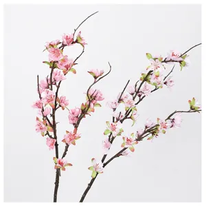 Artificial peach blossom branch detail, pink artificial flower for home decor photography.