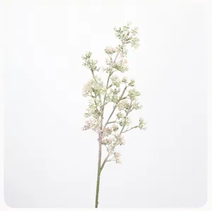 Artificial berry branch detail shot, tiny green fruit floral arrangement for home decor.