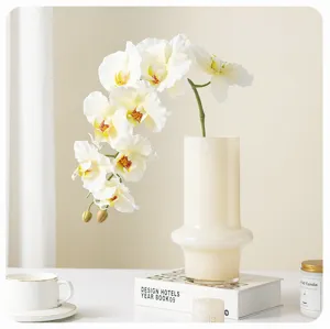 Artificial phalaenopsis flower detail view, white orchid bouquet for home decor photography.