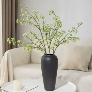 Artificial green berry branch in black ceramic vase Nordic home decor floral arrangement