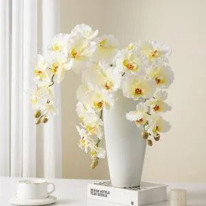 Artificial Phalaenopsis orchid flowers in white ceramic vase for stylish home decor