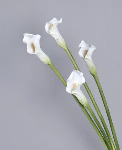 Detailed shot of artificial calla lily flowers made of thick PU material with green stems.