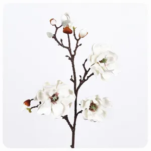Close-up detail shot of artificial white magnolia branch, realistic PU floral home decor.