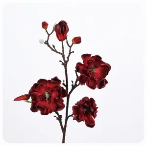 Closeup of artificial red magnolia flower branch, realistic PU floral detail for decor.
