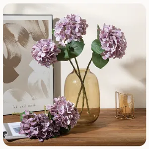 Artificial hydrangea flower branch 3D large purple fake floral home decor detail shot.