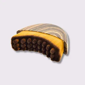 Lymphatic contour face brush with wood grain handle and dense wavy bristles for facial massage.