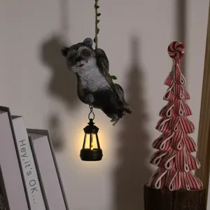 Hanging raccoon solar garden statue with LED lantern outdoor tree animal ornament decor.
