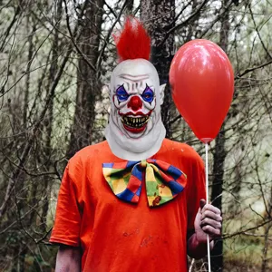 Scary Halloween clown latex mask with red wig and costume props for party cosplay events.