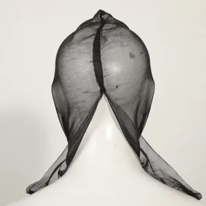 Close-up detail of black mesh pullover head mask prop, breathable fabric for Halloween party.