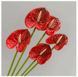 Artificial red anthurium flower detail, realistic 3D single fake plant for home decor.
