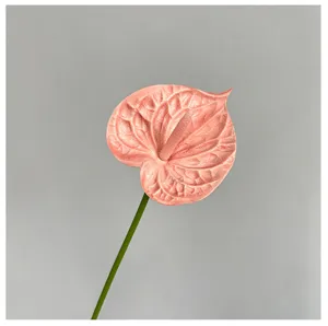 Close-up detail view of the realistic pink anthurium flower for wedding decor setup.