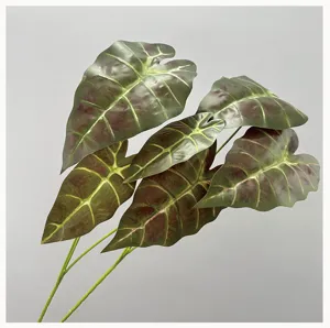 Detailed closeup of artificial alocasia black peacock leaf with vivid veins for floral decor.