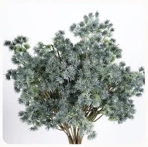 Artificial pine branches detail, frosted pine needles fake plant for home decor and landscape.