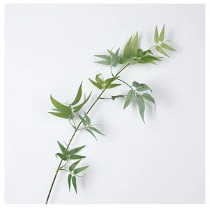 Artificial bamboo branch detail view, realistic green plant leaves for zen home decor.