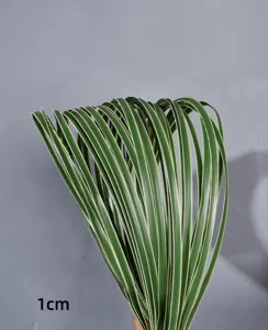 Detail view of artificial grass sword leaves, 1cm width soft rubber floral arrangement material.