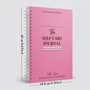 Detail shot of the pink spiral journal cover featuring mental health journal typography.