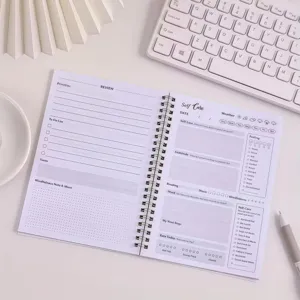 Self-care spiral journal notebook for daily mental health tracking, mood and habit management.