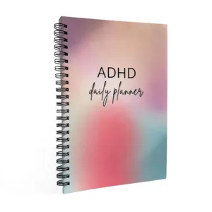 ADHD daily planner notebook with spiral binding, colorful gradient cover and daily schedule layout.