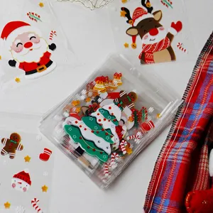 Close-up of clear Christmas self-adhesive candy cookie bags with cute cartoon designs.