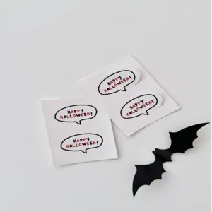 Halloween speech bubble sticker detail shot showing festive design and clean white paper sheets.
