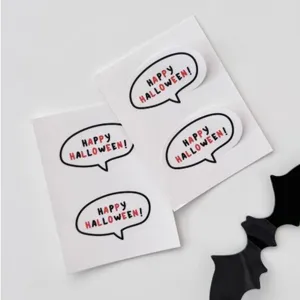 Detailed close-up of Halloween speech bubble stickers featuring festive holiday typography.