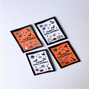Detail view of Halloween greeting cards with cute ghost and pumpkin icons for festive notes.
