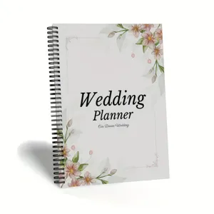 Elegant floral wedding planner notebook with spiral binding for bride planning.