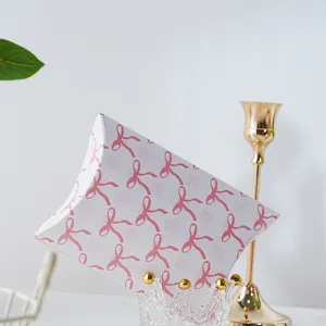 Detailed view of pink bow grid paper packaging box, elegant pillow gift box for cookies.