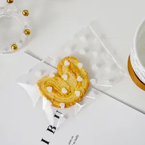 Detailed view of white heart self-adhesive packaging bag, minimalist ins style for gifts.