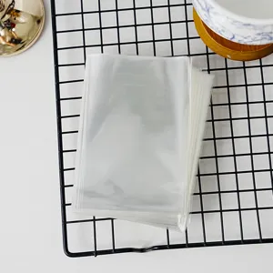 Clear OPP flat plastic bags detail view, transparent packaging bags for gifts, crafts, and food.