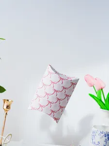 Detailed view of the pink bow checkered pillow paper box for cookie and gift packaging.
