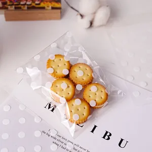Clear self-adhesive packaging bag with white polka dots, ideal for gifts, cookies and bakery.