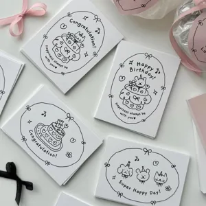 Minimalist black and white greeting cards with cute hand-drawn cake designs for birthday gifts.