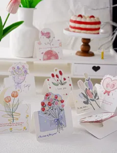 Kit de cartes de vœux avec de jolies illustrations florales et des messages chaleureux.