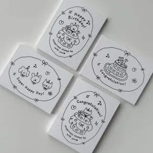 Minimalist black and white hand-drawn birthday greeting cards detail view showing cute designs.