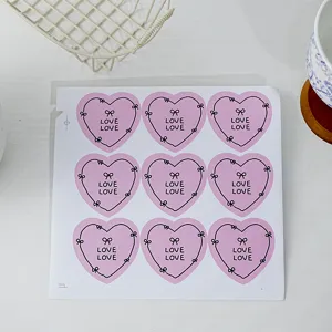Cute hand-drawn bow heart stickers, 9 pieces per sheet, perfect for journaling and crafts.