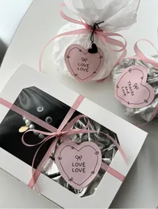 Aesthetic pink heart bow stickers and gift packaging tags, perfect for journaling and crafts.