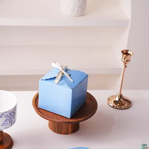 Blue gift packaging box with lace edge and ribbon for wedding birthday candy gift detailing.