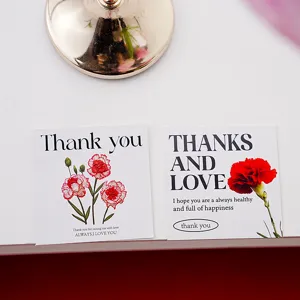 Close-up detail of Mother's Day greeting cards with floral design and warm blessing text.