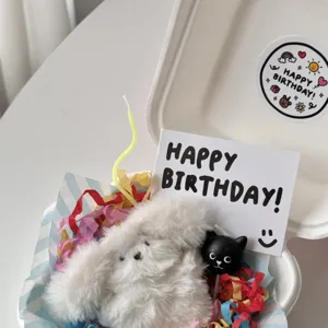 Cute birthday gift box set with fluffy plush toy, greeting card and decorative stickers.