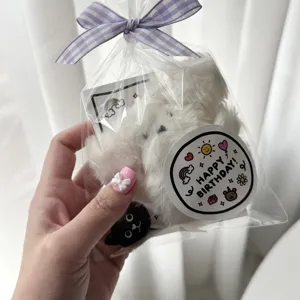 Cute happy birthday round cartoon sealing sticker for gift packaging and party decor.