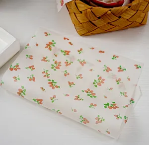 Detailed shot of cute strawberry printed greaseproof baking paper for food packaging and wrapping.