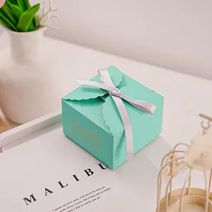 Teal paper gift box with silver ribbon, scalloped edge design for wedding candy or birthday party.