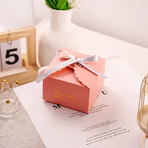 Pink gift box with silver ribbon and gold foil details, perfect for candy and party favors.